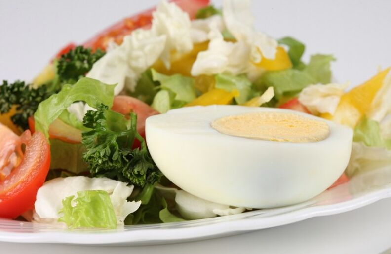 Fresh vegetable salad with boiled egg in the Maggi diet menu